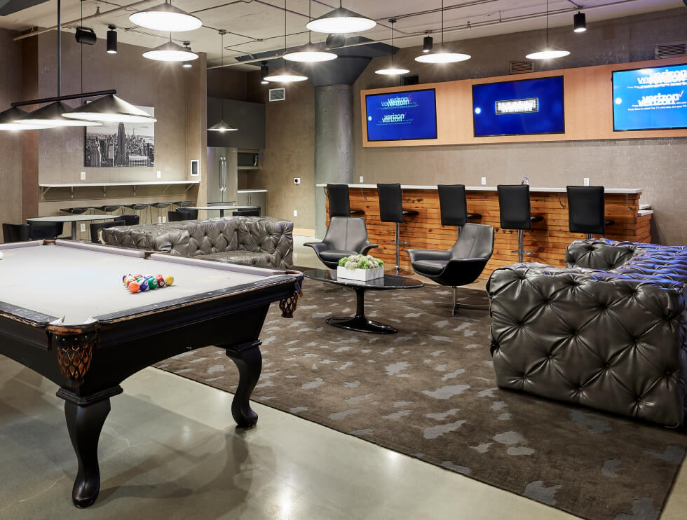 Pool table, bar and tv screens in the parkway lofts clubroom